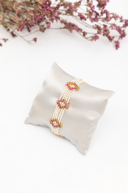 Bracelet with Rubies, Emeralds and Pearls in 22k Gold.